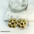 Detailed macro view of gold textured flower earrings showing size and weight specs - Textured Four-Petal Flower (ES812)