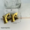 Close-up of stylish gold wavy geometric stainless steel earrings with size details - Irregular Geometric Wave (ES820) / Gold