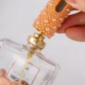 Botella atomizador de perfume recargable portátil de 6ml con tapa de perlas naranjas y bomba. - Champán