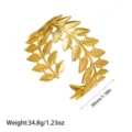 Detail view showing 30mm width and weight of this golden leaf pattern cuff bracelet - Double Row Overlapping Leaf Style (YY195) / Gold