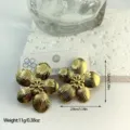 Close-up of gold stainless steel striped flower earrings showing dimensions and weight - Textured Petal Style (ES847)