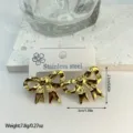 Detailed view of glossy gold-colored stainless steel bow earrings with measurements. - Pleated Textured Bow Style (ES855)