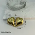 Elegant gold stainless steel ridged heart-shaped stud earrings with metallic finish - Vertical Striped Heart (ES884)