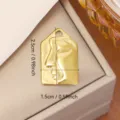 Gold titanium steel pendant featuring minimalist abstract face profile relief, DIY charm - Abstract Face (0142) / 2.5x1.5cm