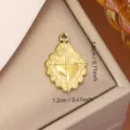 Gold titanium steel heart pendant with intricate borders, 1.8cm x 1.2cm dimensions. - 1.8x1.2cm