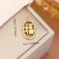 Gold stainless steel oval Fu pendant with rhinestone trim measuring 1.8cm by 1cm - "Fu" Character Rhinestone Style (0115) / Gold