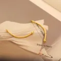 Componente per gioielli fai-da-te curvo in acciaio al titanio dorato lungo 4,8 cm - 052 Tubo Curvo Lucido