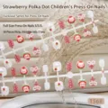 Macro view of 30pcs children's press-on nails with cute rabbit and strawberry patterns. - Strawberry Polka Dot Style (T568) / 30 Packs / Pink