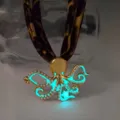 Luminous octopus pendant necklace with leopard print ribbon strap and cyan glow - Gold Cyan Glow Necklace