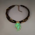 Detailed view of glow-in-the-dark jellyfish pendant on leopard print ribbon necklace - 2# Gold-Toned Green Glow Necklace