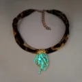 Detail of a luminous jellyfish pendant necklace with leopard print ribbon and pearls. - 3# Gold-Toned Cyan-Green Glow Necklace
