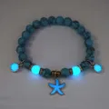 Detailed view of luminous blue beaded bracelet with glowing starfish charm - Bracelet / Gold (Blue Turq Blue)