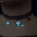 Macro detail shot showing blue glow-in-the-dark pumpkin charms on a black choker necklace - Pumpkin Blue Glow (1#)