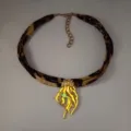 Close-up of leopard print ribbon necklace with a glowing jellyfish pendant and pearls. - 4# Gold-Toned Orange-Red Glow Necklace