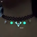 Detailed view of luminous green skull and cross pendants on black fishline choker - Skull Green Glow (4#)