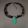 Close-up of luminous jellyfish pendant glowing in cyan with a leopard print ribbon - 7# White Gold-Toned Green Glow Necklace