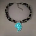 Luminous jellyfish pendant detail with glowing blue light on leopard print ribbon. - 8# White Gold-Toned Cyan-Green Glow Necklace