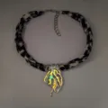 Detailed view of a luminous jellyfish pendant necklace with a leopard print ribbon strap - 9# White Gold-Toned Orange-Red Glow Necklace