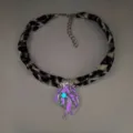 Detailed view of the luminous jellyfish pendant glowing purple and blue on leopard ribbon - 10# White Gold-Plated Rose Red Necklaces