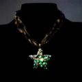 Detailed view of luminous five-pointed star pendant with leopard print strap - Necklace / Gold (Green Light)