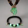 Detailed shot of luminous jellyfish pendant and glowing star beaded bracelet set - 17# Gold-Tone Green Luminous Necklace & Bracelet Set