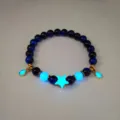 Detail of luminous deep sea star bracelet with glowing blue star and bead accents - Luminous Star Bracelet / Gold Blue Tiger Eye (Bracelet)