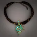 Luminous conch shell necklace with leopard print choker and blue glow-in-the-dark pendant - Necklace / Gold Cyan Light