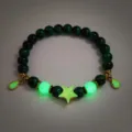 Detailed view of dark green beaded bracelet with glowing star and waterdrop charms - #12 Golden Green Tiger's Eye Bracelet