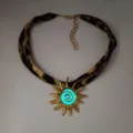 Gold plated sun pendant necklace with blue luminous spiral on leopard print cord - Gold Cyan Glow Necklace