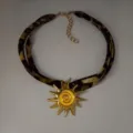 Leopard print fabric choker necklace with a golden sun spiral pendant. - Gold Orange-Red Necklace