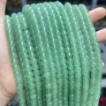 Macro detail of natural green aventurine old-shaped jade beads for DIY jewelry making - Antique Style Beads / 7*8mm (Approx 50 Pieces/Pack) / Natural Green Aventurine
