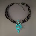 Glow-in-the-dark conch shell necklace with leopard print fabric strap and pearls. - Necklace / Silver Teal Glow