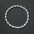Detailed view of silver-toned flower cross tennis bracelet with rhinestones - 8inch(20cm) / Silver Tone White