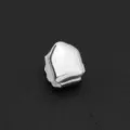 Close-up detail of a silver smooth single tooth grill cap for hip-hop style - Smooth Silver