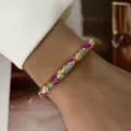 Close-up detail of a macaron pastel enamel slim gold-tone bangle worn on a female wrist - Colorful Drip Irregular Blocks (883-5)