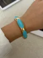 Elegant retro enamel bangle with turquoise drip oil design in a polished gold finish. - Blue Gold