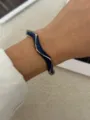 Vintage gold-plated wavy bangle with navy blue enamel finish for women - Blue Sugar Cube