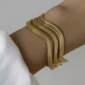 Bracciale rigido aperto a onde in acciaio inossidabile dorato con texture increspata - Stile onda d'acqua