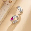 Macro detail view of retro silver-tone open ring set featuring a ruby red gemstone inlay - Silver Rose Red Stone Combo Style (7142) / Two-Piece Set / Silver