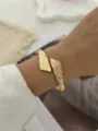 Elegante bracciale rigido dorato con trama di bambù vintage e design geometrico incrociato - Stile Incrociato Trama Bambù Dorato (A829-4)