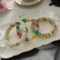 Braccialetti di perle di resina colorata con distanziatori dorati, stile elastico - Set Sovrapposto / Set Contrasto Crema (824-3)
