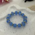 Bracciale con perline di pietra blu irregolari e distanziatori dorati stile vacanza - Stile con Perline Irregolari (823) / 13 Pezzi (10mm) / Celeste