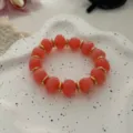 Boho-Armband mit korallenrosa Imitationsachat-Perlen und goldenen Distanzstücken für Urlaub - Unregelmäßiger Perlenstil (823) / 13 Stück (10mm) / Rosa