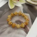 Unregelmäßiges bernsteinfarbenes Perlenarmband mit goldenen Zwischenstücken - Unregelmäßiger Perlenstil (823) / 13 Stück (10mm) / Orange