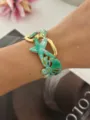 Elegante geëmailleerde oceaan-thema manchetarmband met zeester en zeedier bedeltjes - Starfish seaweed green