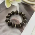 Schickes Armband aus braunen Steinen mit goldenen Zwischenstücken im Tigerauge-Stil - Unregelmäßiger Perlenstil (823) / 13 Stück (10mm) / Dunkelbraun
