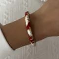 Close-up of vintage Chinese style enamel bangle with red and white floral patterns - 6CM Diameter / Red White Floral (2#BR26Y0270-4)