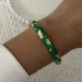 Macro detail of a vintage green enamel bangle with intricate gold floral patterns - 6CM Diameter / Dark Green Gold Floral (3#BR26Y0271-1)