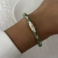 Detail view of a vintage enamel floral bangle bracelet adorned with sparkling crystals - 6CM Diameter / Dark Green Rhinestone Floral (4#BR26Y0272-1)
