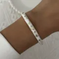 Detailed view of an elegant white enamel bangle featuring gold vine and crystal accents - 6CM Diameter / White Gold Vine Rhinestone (BR26Y0271-5)